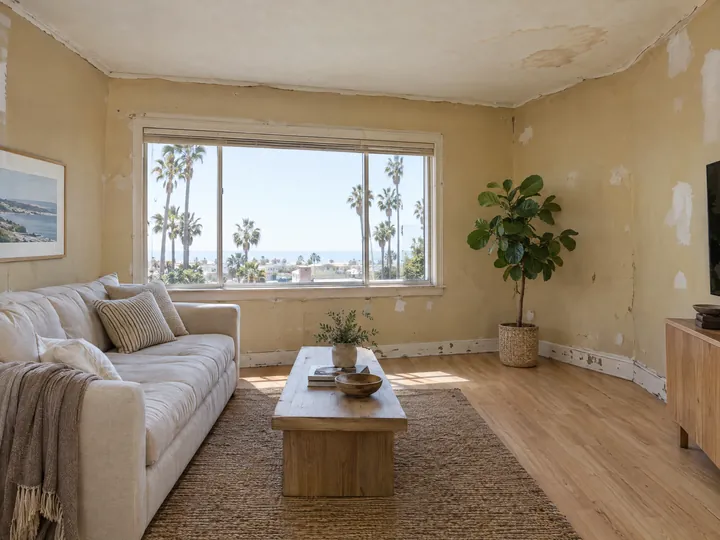 Before: Living room with yellowed, scuffed walls, drywall patches and a stained ceiling